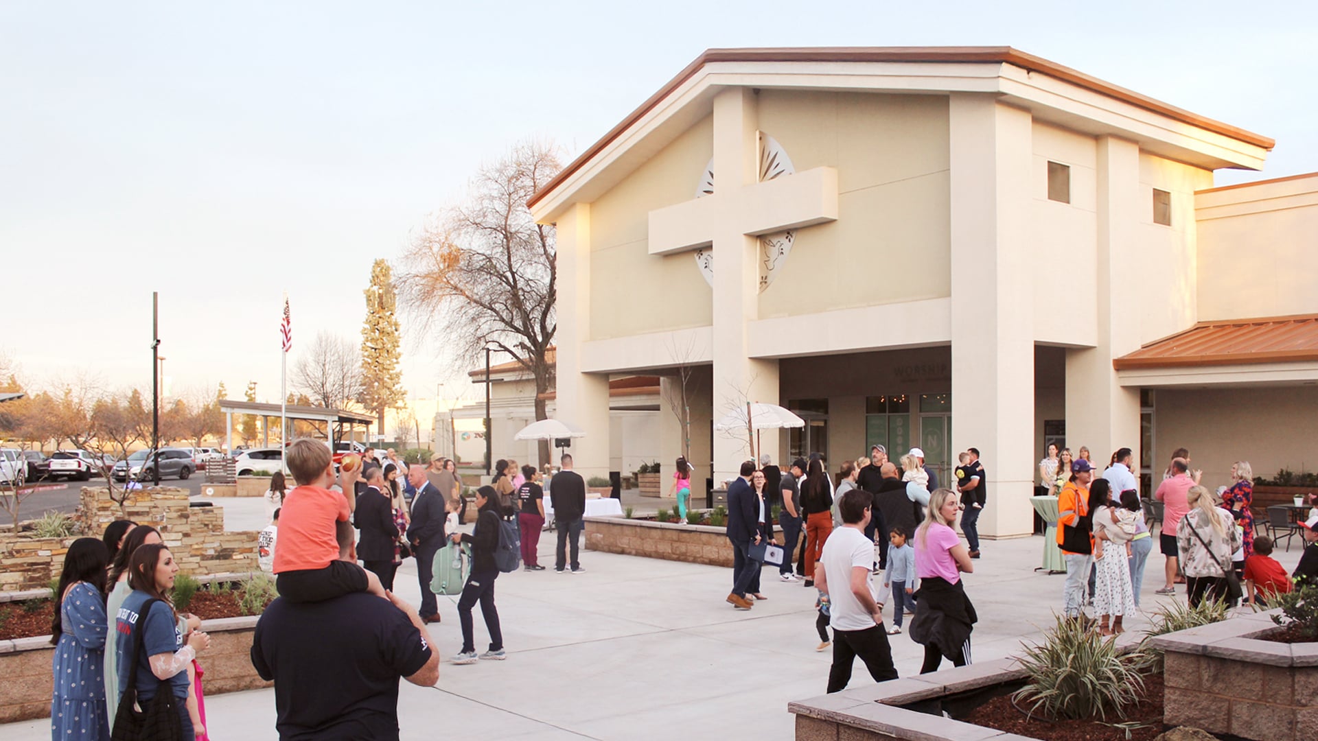 Families arriving at the Fresno New Covenant Community Church campus on a Sunday morning