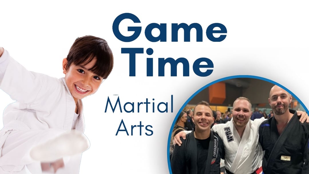 Game Time Martial Arts promotional graphic featuring a smiling young boy performing a high kick